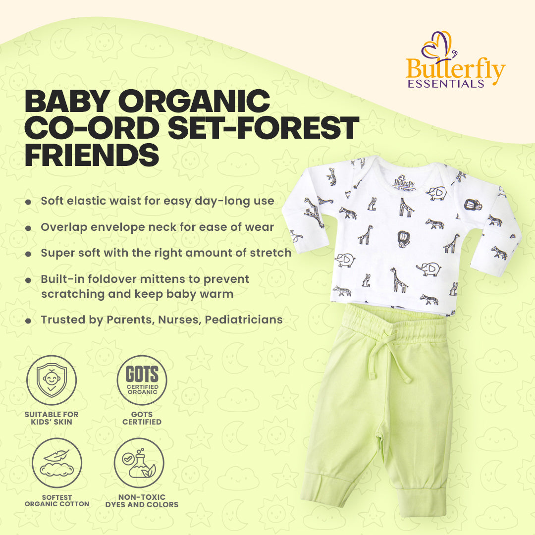 Baby organic co-ord set with green pants and white top with animal prints on a light green background, featuring the Butterfly Essentials.